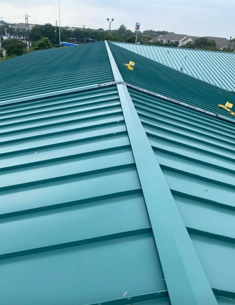 Green commercial metal roof ridge and valley for Metal Roof Repair in Lowes Island